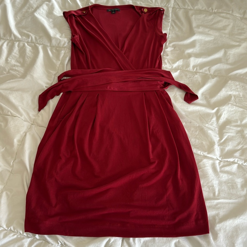 Sleeveless red waist tie mini dress with gold shoulder buttons